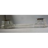 A chamfered clear glass deskstand, the c