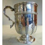 An Edwardian silver tankard, the cup sha