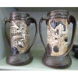 A pair of early 20thC brown glazed and m