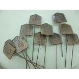 A set of twelve cast metal herb markers