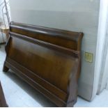 A modern mahogany finished sleigh bed fr