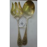 A pair of silver coloured metal salad se