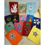 Sixteen different handmade beadworked Christmas cards,