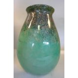 A Monart opaque emerald green glass vase of ovoid form with a flared rim,