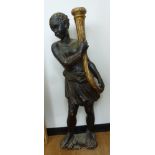 An early 20thC carved and polychrome painted standing blackamoor,