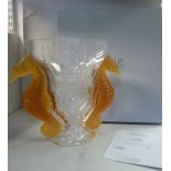 A Lalique glass Poseidon vase with tinted amber coloured seahorses,