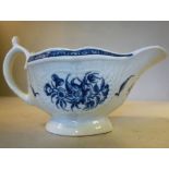 A late 18thC Worcester porcelain footed sauce boat, having moulded ornament,