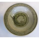 A late 18thC Chinese celadon glazed porcelain, broad rimmed, footed bowl,