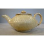 An early 19thC Wedgwood cream glazed, moulded basketweave earthenware miniature,