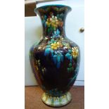 A TH Deck majolica vase of ovoid form, having a narrow neck and flared rim,