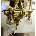 An early 20thC neo-classically inspired cast gilt metal centre light, comprising a circular frame,