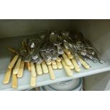 A part set of silver plated Kings pattern flatware; miscellaneous table knives;