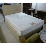 A modern divan bed with a two part base 54''w;