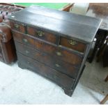 An early 18thC walnut crossbanded oak dressing chest, having three in-line drawers,