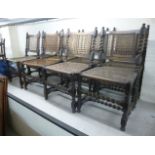 A set of eight early 20thC stained beech framed dining chairs, each with a caned back and seat,