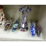 A graduated set of four End of Day glass model fish largest 4''h 14''L;