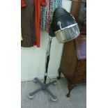 A retro Eugene salon hood dryer with a height adjustable column and a splayed plinth,