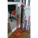 A pair of modern red painted metal anglepoise table lamps CA