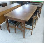 A 1970s Archie Shine teak dining table, the top with bowed sides, raised on square legs,