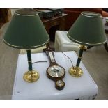 A pair of modern green painted and brass table lamps,