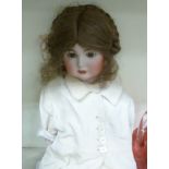 A modern Robinson copy of a Simon & Halbig bisque head doll with painted features,
