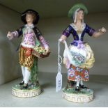 A pair of late 19thC Continental porcelain figures,