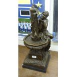 A cast and patinated bronze figure,