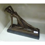 A cast and patinated bronze figure, an Art Deco style woman dancing,