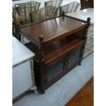 A modern oak finished tea trolley with two shelves, over a pair of lead glazed doors,