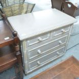 A modern lime washed, beech and bamboo effect three drawer dressing chest,