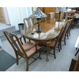 A modern American style cherrywood finished extending dining table,