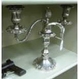 A late Victorian James Dixon twin branch candelabra with embossed fruiting vine ornament 10''h