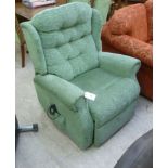 An electric reclining armchair,