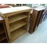 Small modern pine furniture: to include a bookcase, on a plinth 39''h 33''w; and a CD rack,