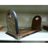 An early 20thC mahogany bookslide with opposing foliate cast brass mounts 12''w OS1