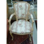 A modern French style beech framed open arm chair with an upholstered back and seat,