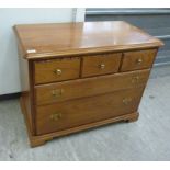 A modern cherry wood dressing chest with three short/two graduated long drawers,