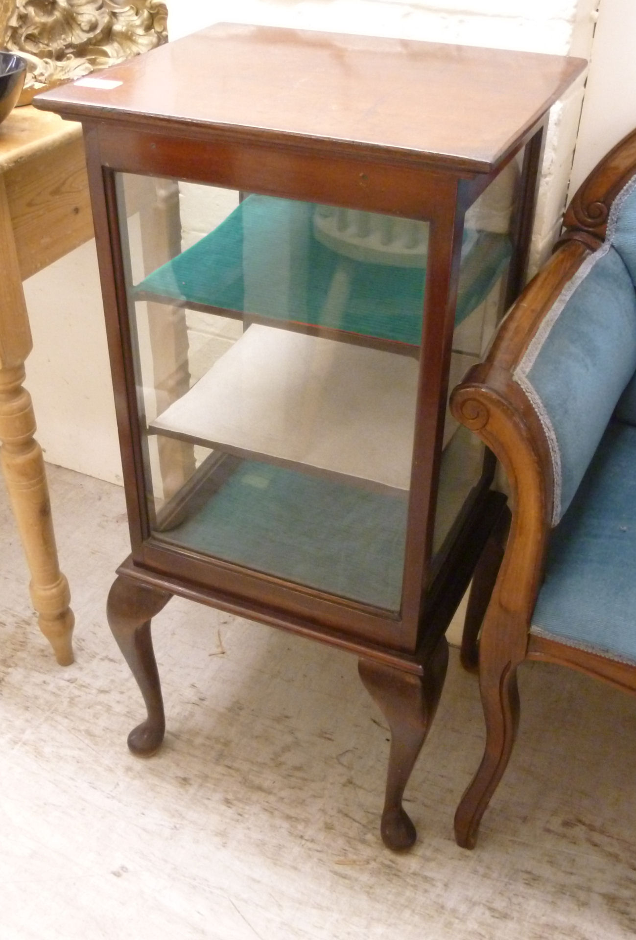 An early 20thC mahogany display cabinet with glazed sides,
