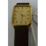 A gentleman's gold plated and stainless steel cased Omega DeVille wristwatch, faced by a baton dial,