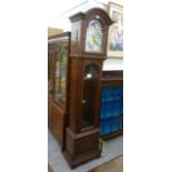 A modern German mahogany finished longcase clock with an arched top,