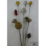 Ten similar paste and other clear and coloured stone set hatpins 11