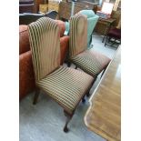 A set of six modern dining chairs with upholstered backs and seats, raised on mahogany finished,