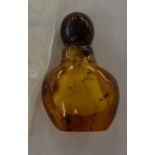 An amber scent bottle of ovoid form with a detachable lid 1.