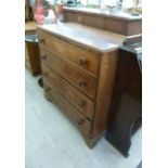 An early 19thC oak four drawer dressing chest,