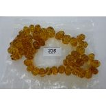 An amber bead necklace with ribbed decoration 11