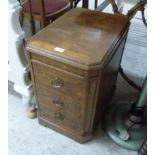 A modern walnut finished three drawer pedestal bedside cabinet,