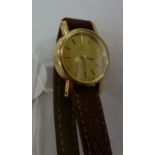 A lady's 9ct gold cased wristwatch, the quartz movement faced a baton dial,