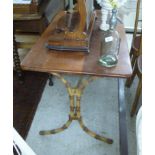 An early 20thC cast iron patio table, having a later teak top,