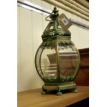 A modern green galvanised metal cylindrical tea light lantern,