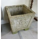 A composition stone garden planter of box design with straight sides,